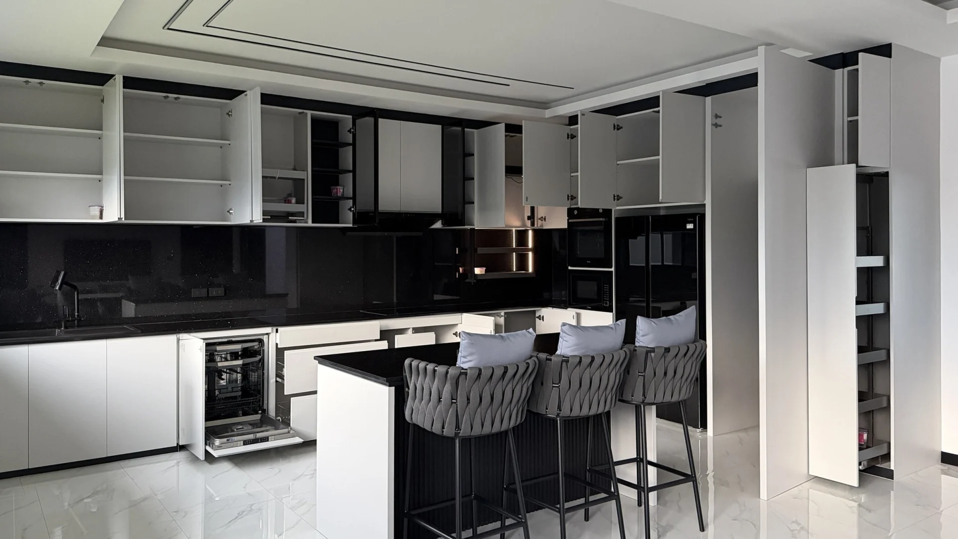 The same view by day with the wall cabinets, pull-out larder, drawers and dishwasher open